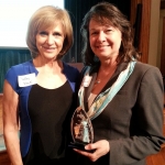 MEK Group Vice President Jamie Snyder (right) accepted the award on behalf of MEK and the Daviess County Economic Development Corporation, which was presented by Debby Knox, CBS news veteran and former WISH-TV news anchor.